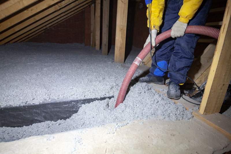 blowing in cellulose insulation into an attic